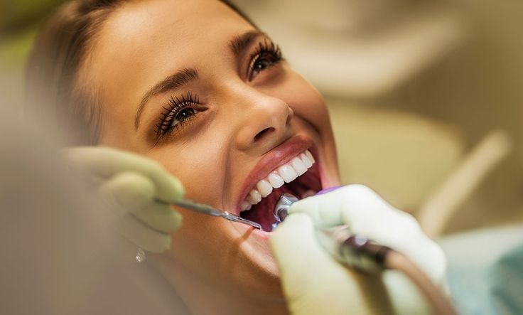 dentist applying composite resin to a tooth